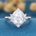 Oval cut Moissanite + Opalrose gold engagement ring