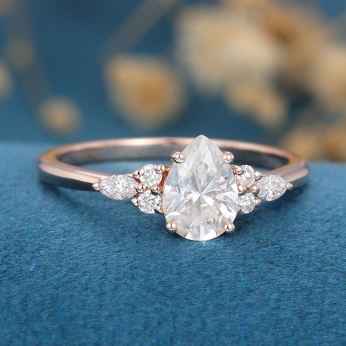 1.25 Carat Pear cut Moissanite Cluster Engagement ring