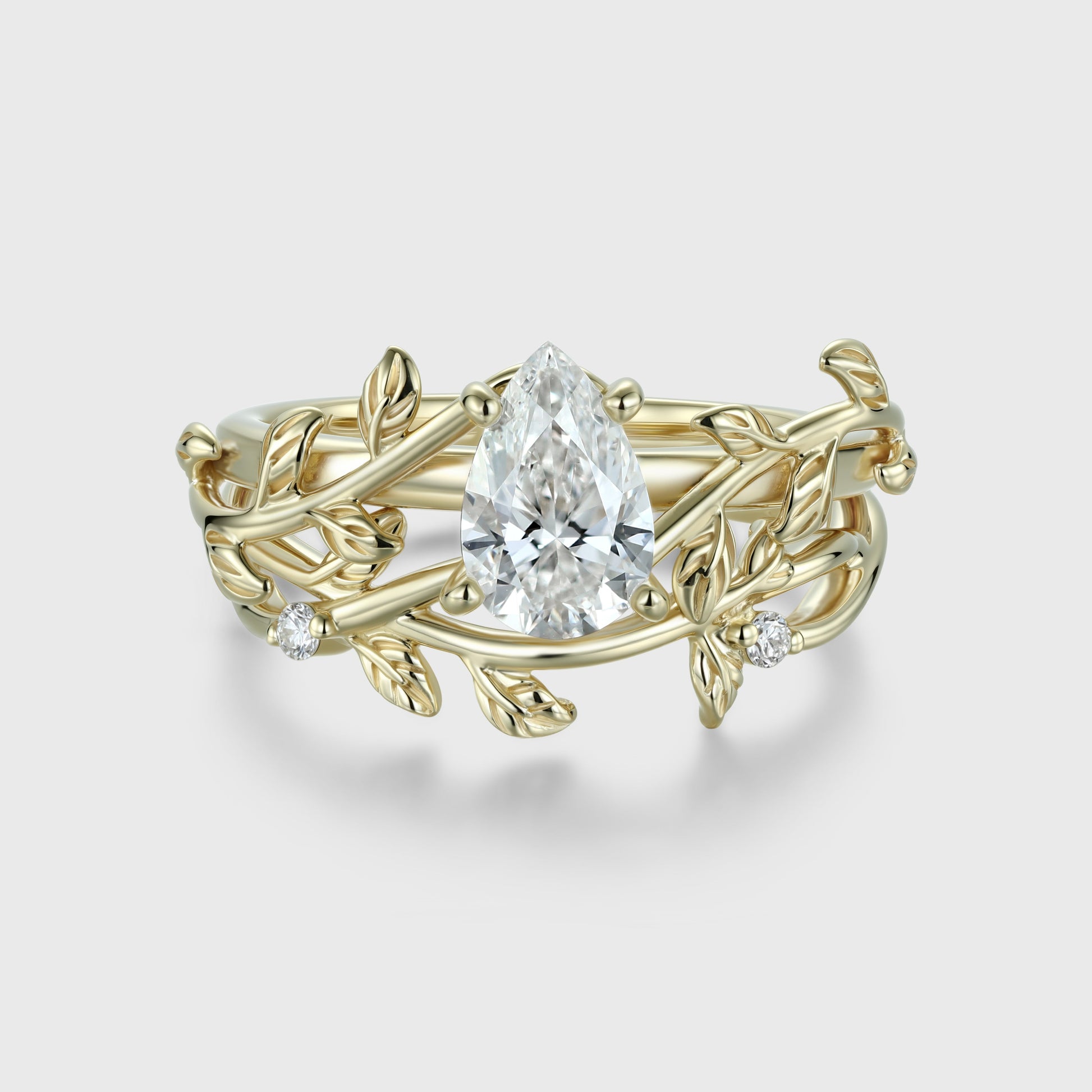 Nature Inspired Pear cut Moissanite Leaf Gold ring set
