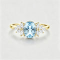 Oval cut Aquamarine Cluster Engagement ring