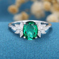 Oval cut Emerald Cluster Engagement ring