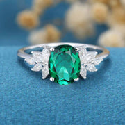 Oval cut Emerald Cluster Engagement ring