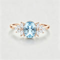 Oval cut Aquamarine Cluster Engagement ring
