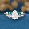 Pear cut Moissanite + Lab Emerald Engagement Ring