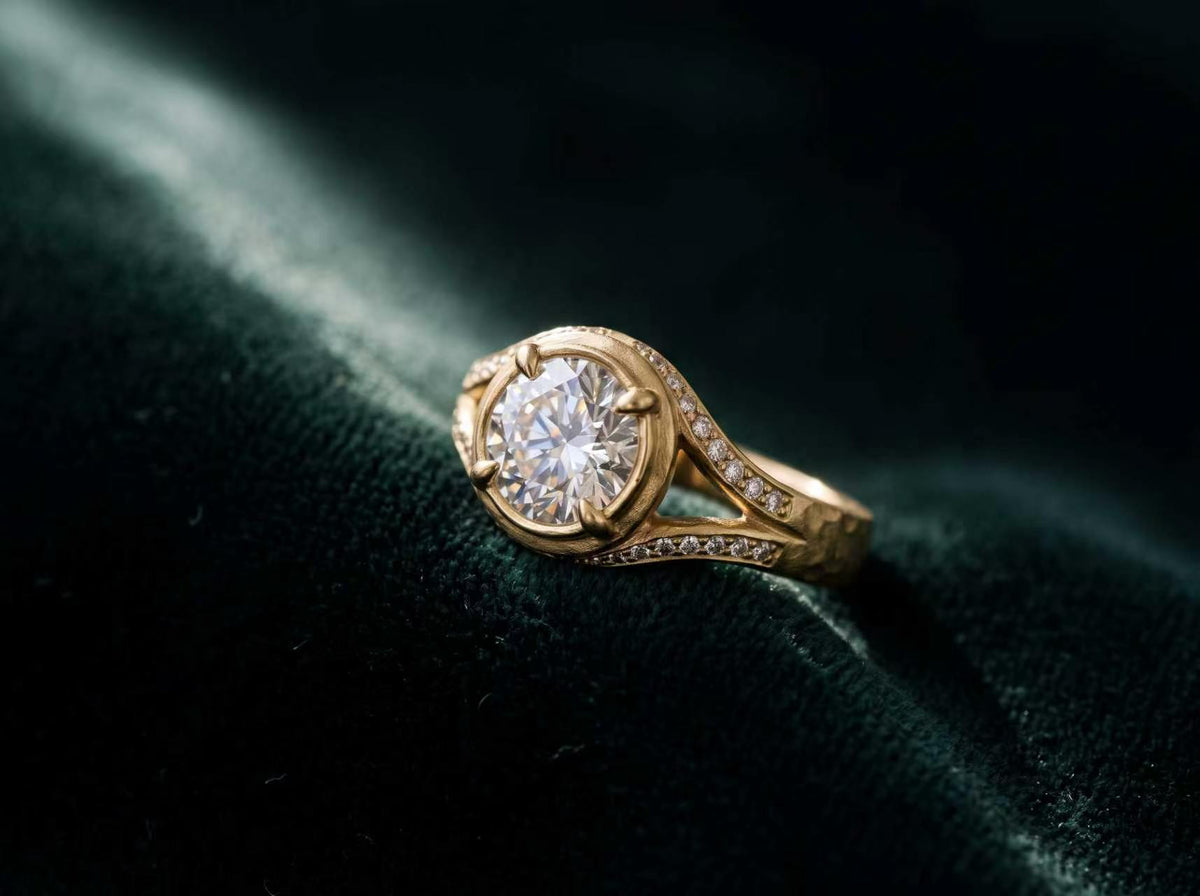 Three one-of-a-kind rings presented in green velvet cases