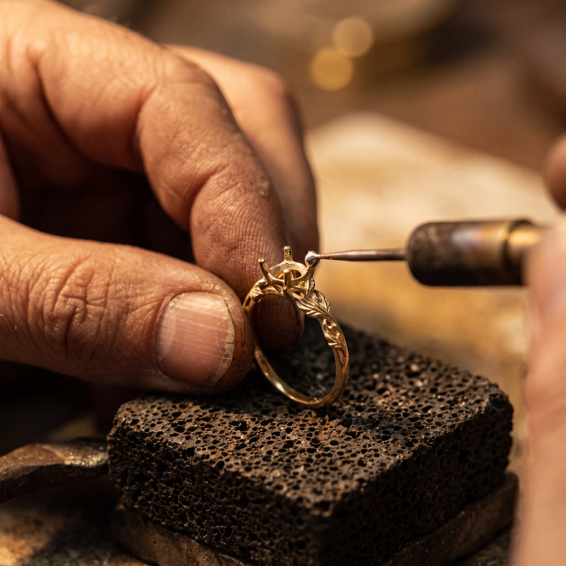 An artisan casting a ring in the FYM workshop