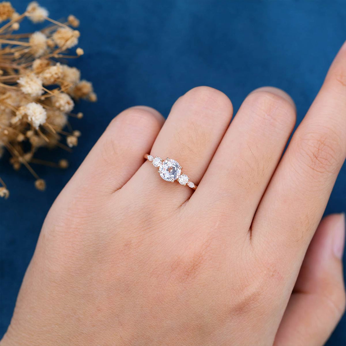 Round cut White sapphire engagement ring