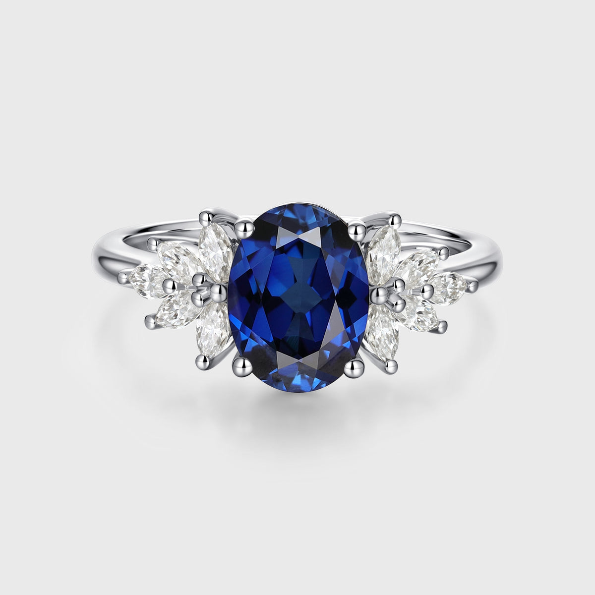 Oval cut Sapphire Cluster Engagement ring