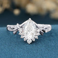 Nature Inspired Pear cut Moissanite Leaf Gold Engagement Ring