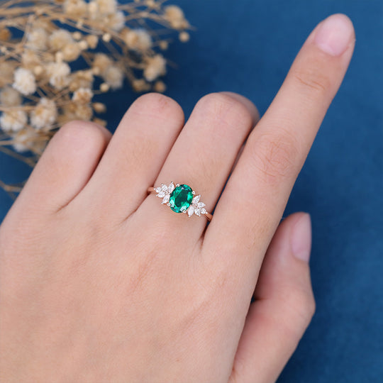 Oval cut Emerald Cluster Engagement ring 